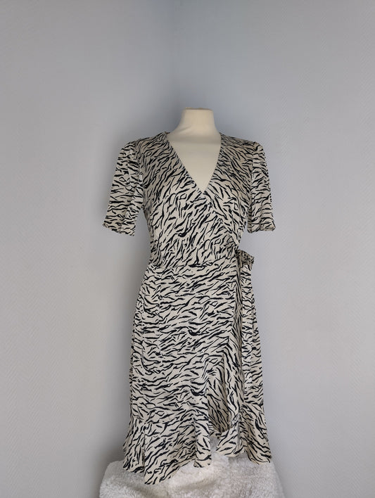 Front view of black and white zebra print wrap dress