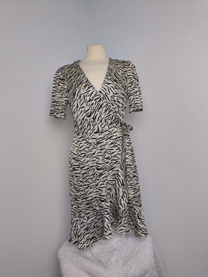 Side view of black and white zebra print wrap dress