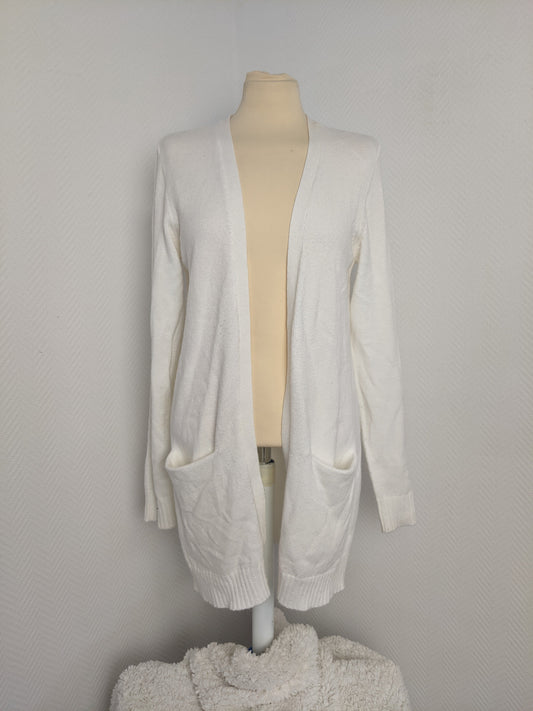 Front view of white open-front knit cardigan