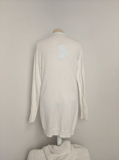 Back view of white open-front knit cardigan