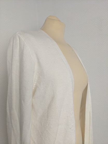 Side view of white knit cardigan