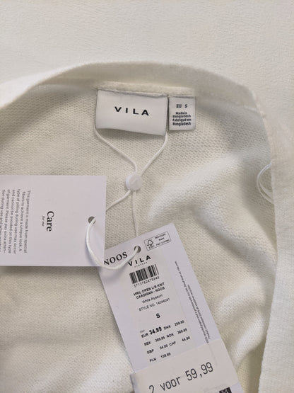 Close-up of Vila label and tag on cardigan