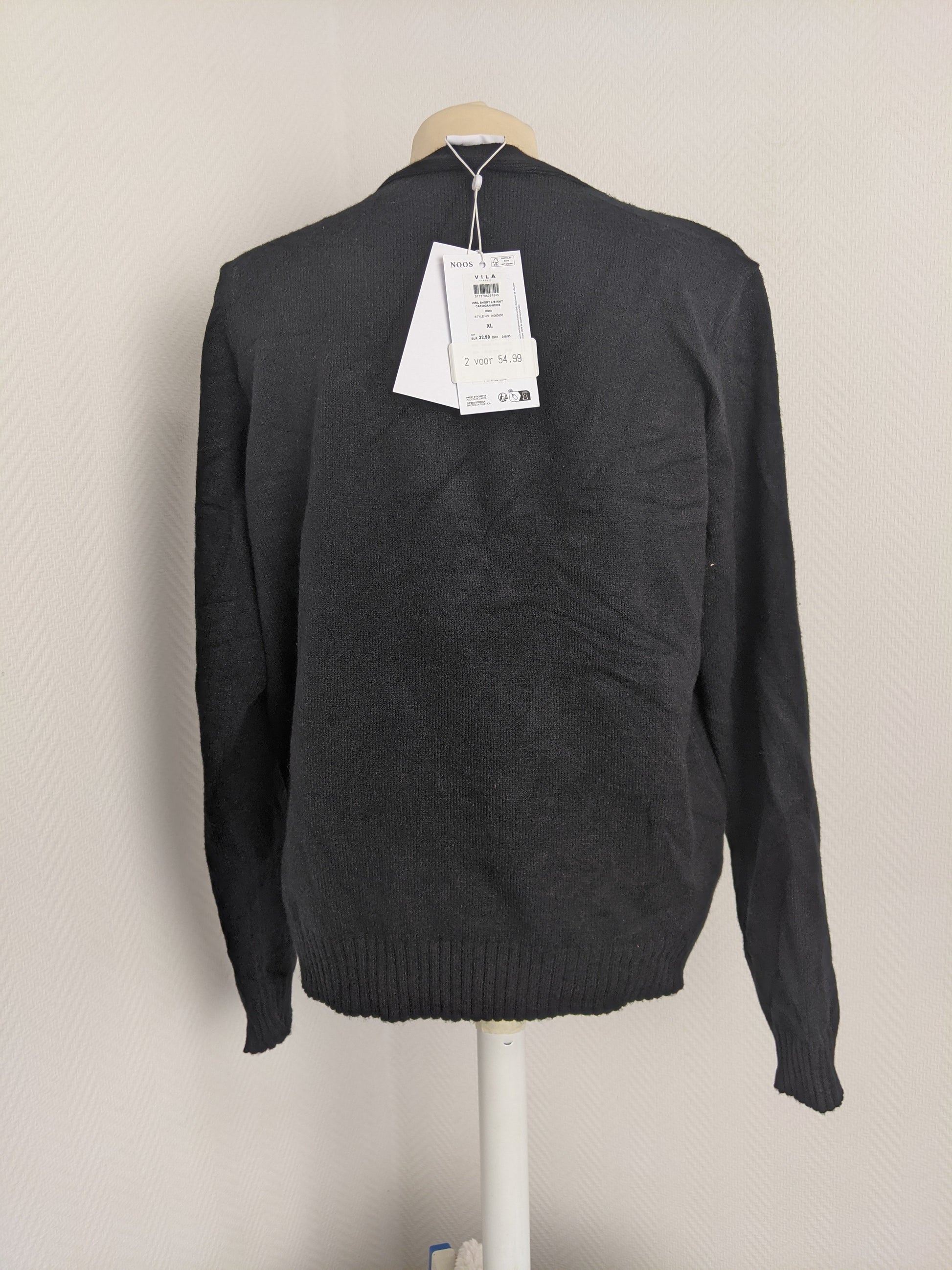 Back view of black knit cardigan with tags
