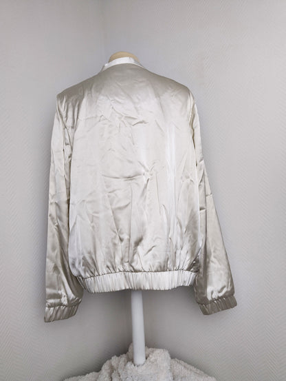 Back view of silver satin bomber jacket