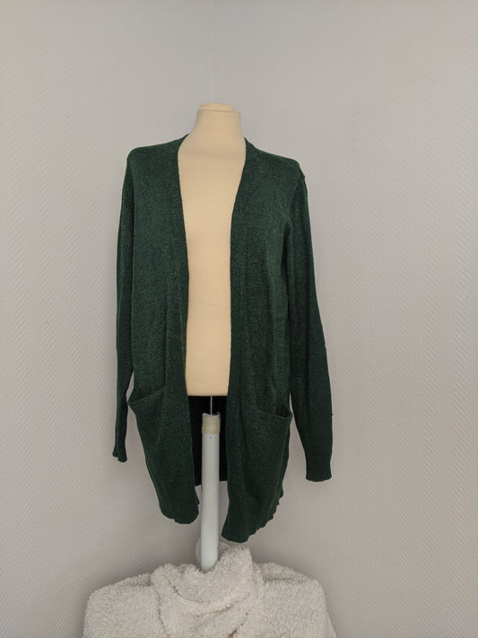 Front view of green open knit cardigan
