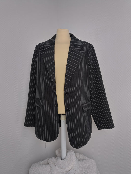 Front view of black pinstripe blazer
