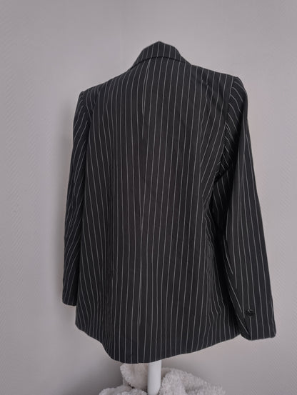 Back view of black pinstripe blazer