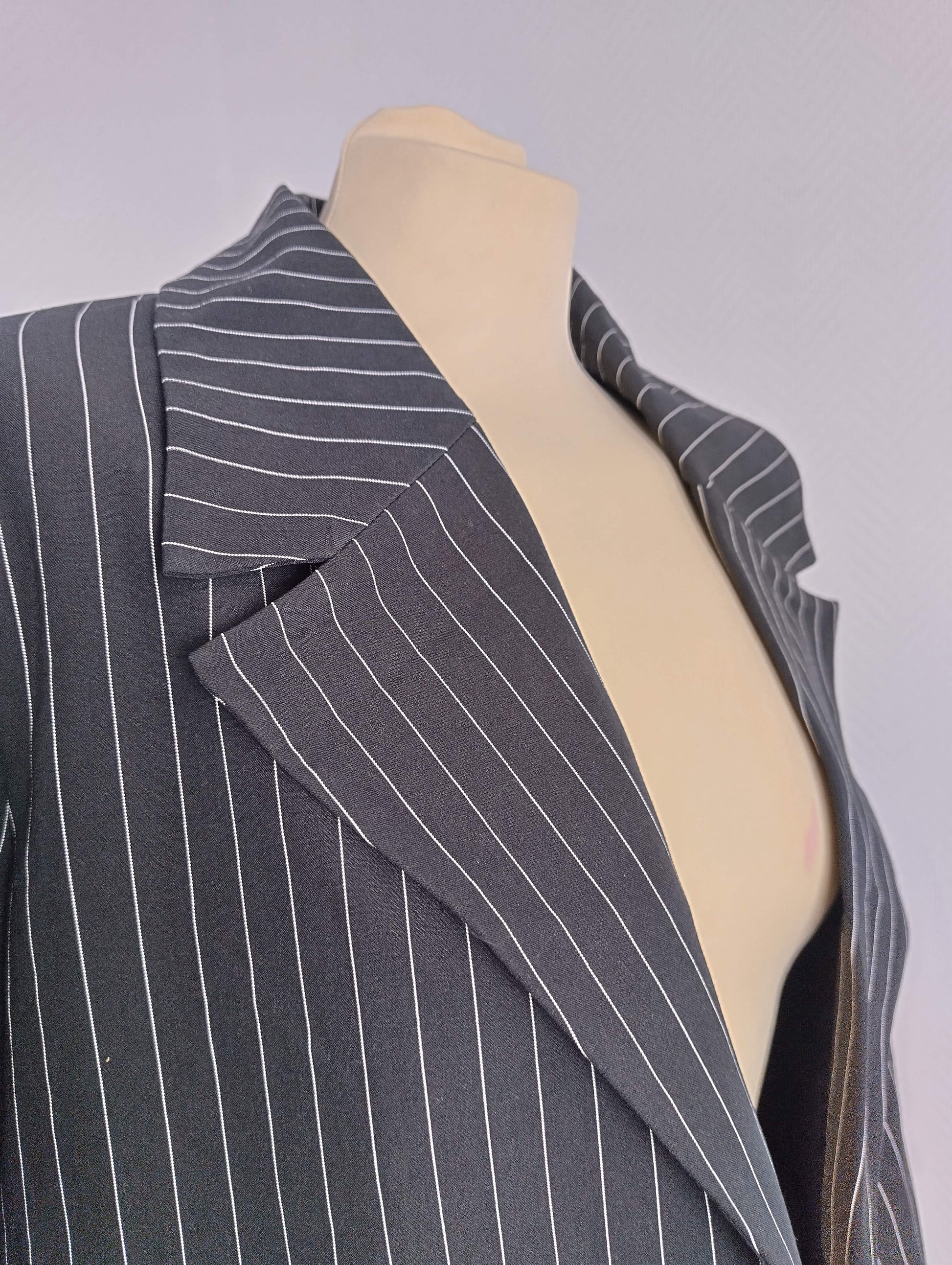 Close-up of collar and lapel on black pinstripe blazer