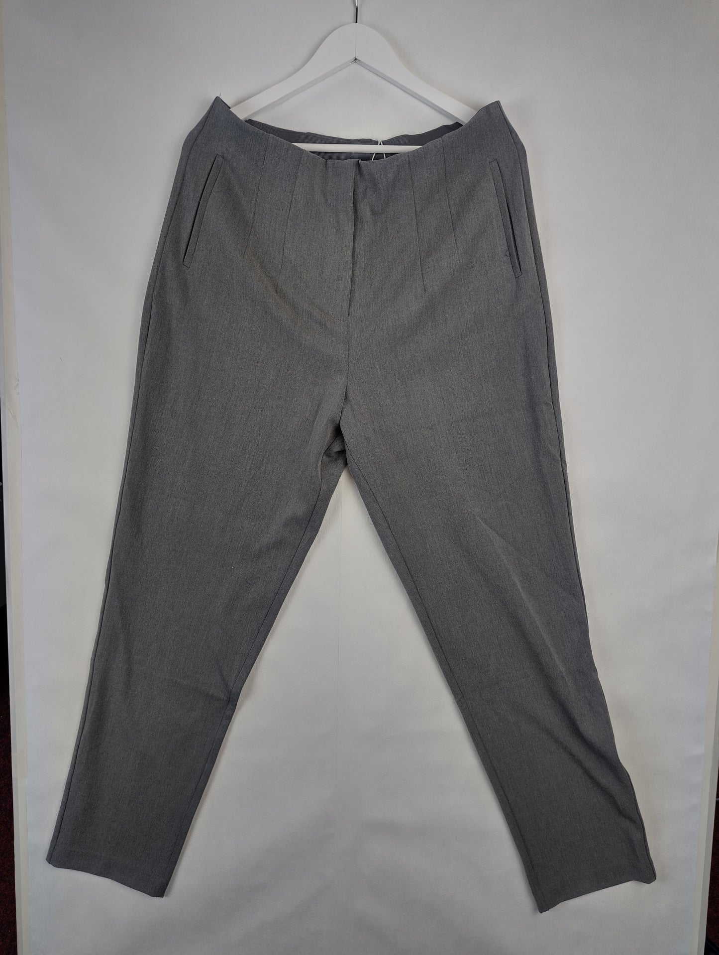 Front view of grey pants on hanger