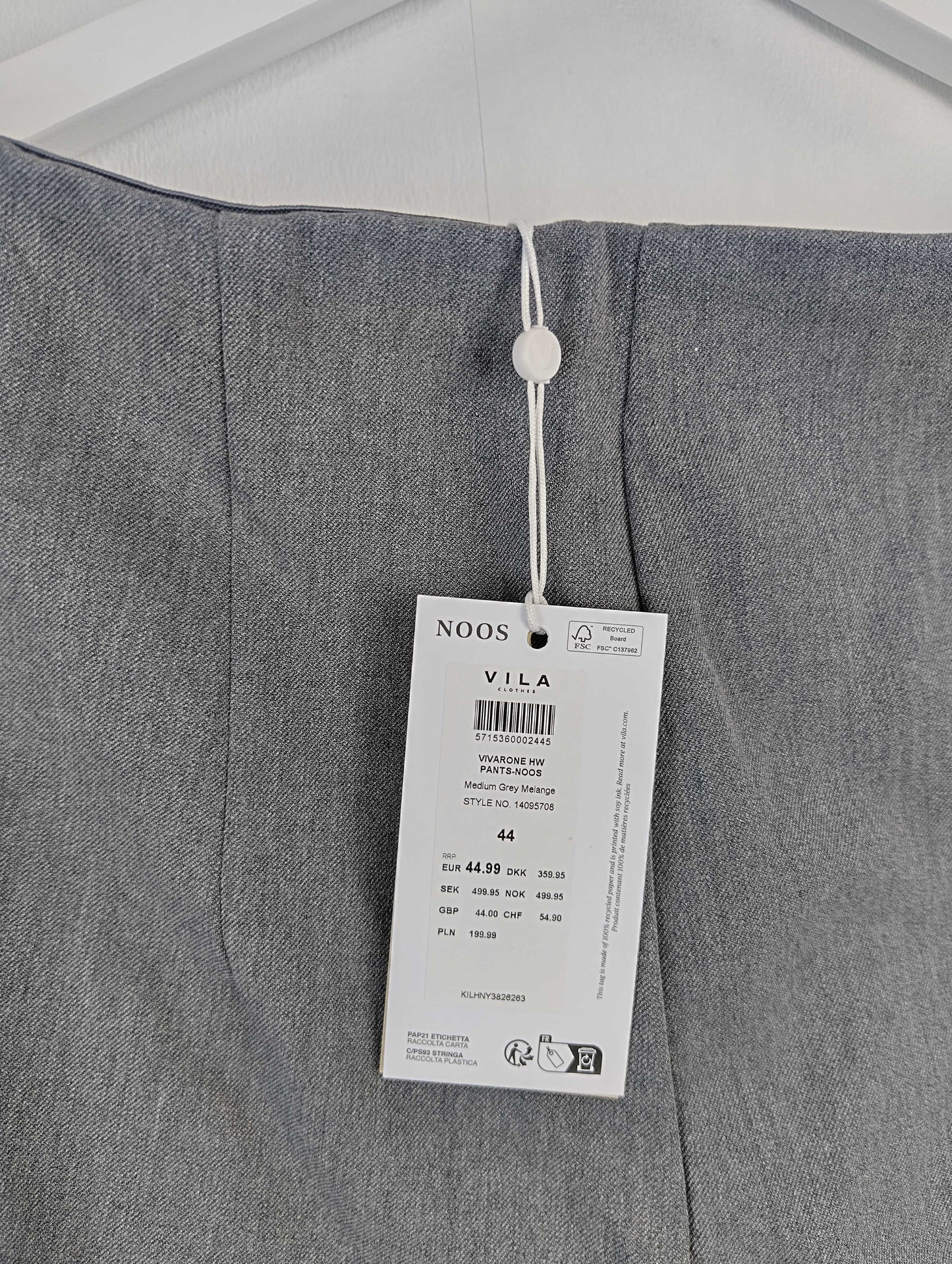 Close-up of label on grey pants