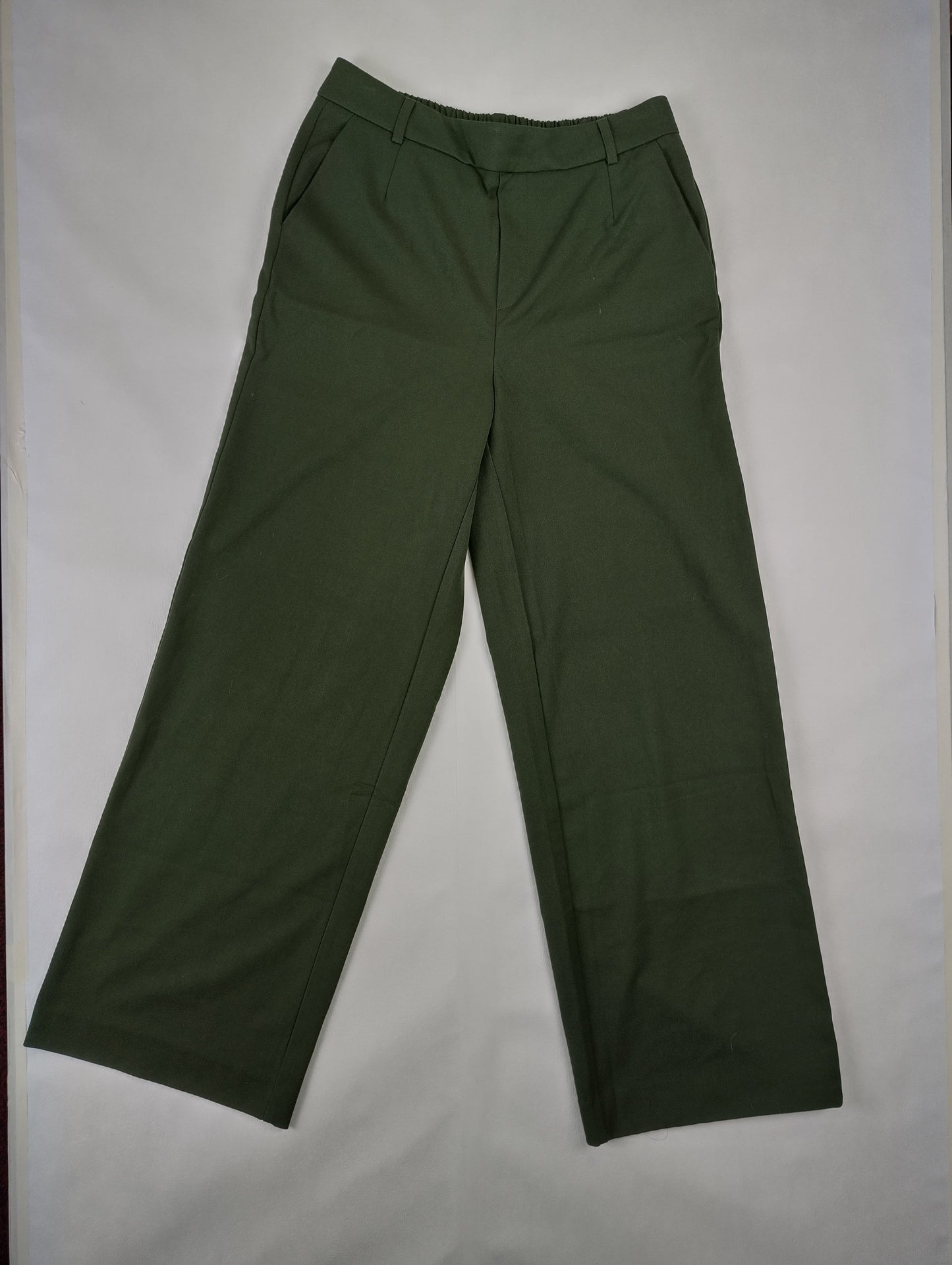 Front view of khaki green wide leg pants