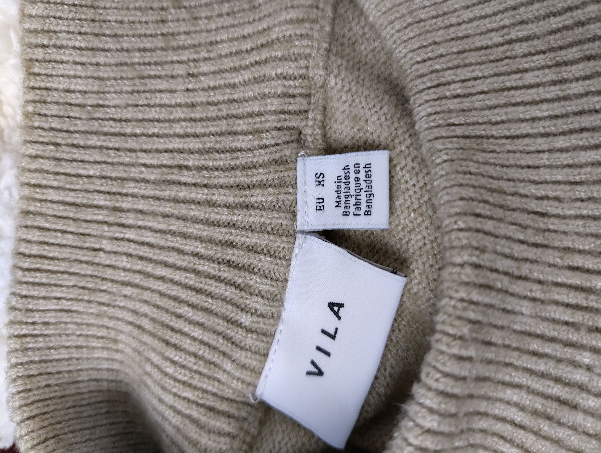 Label of Vila beige knitted sweater dress showing size XS