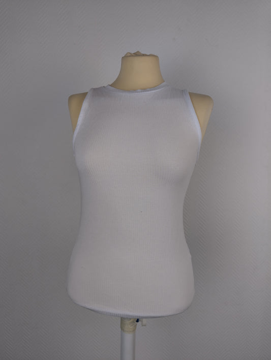 Front view of white ribbed tank top on mannequin