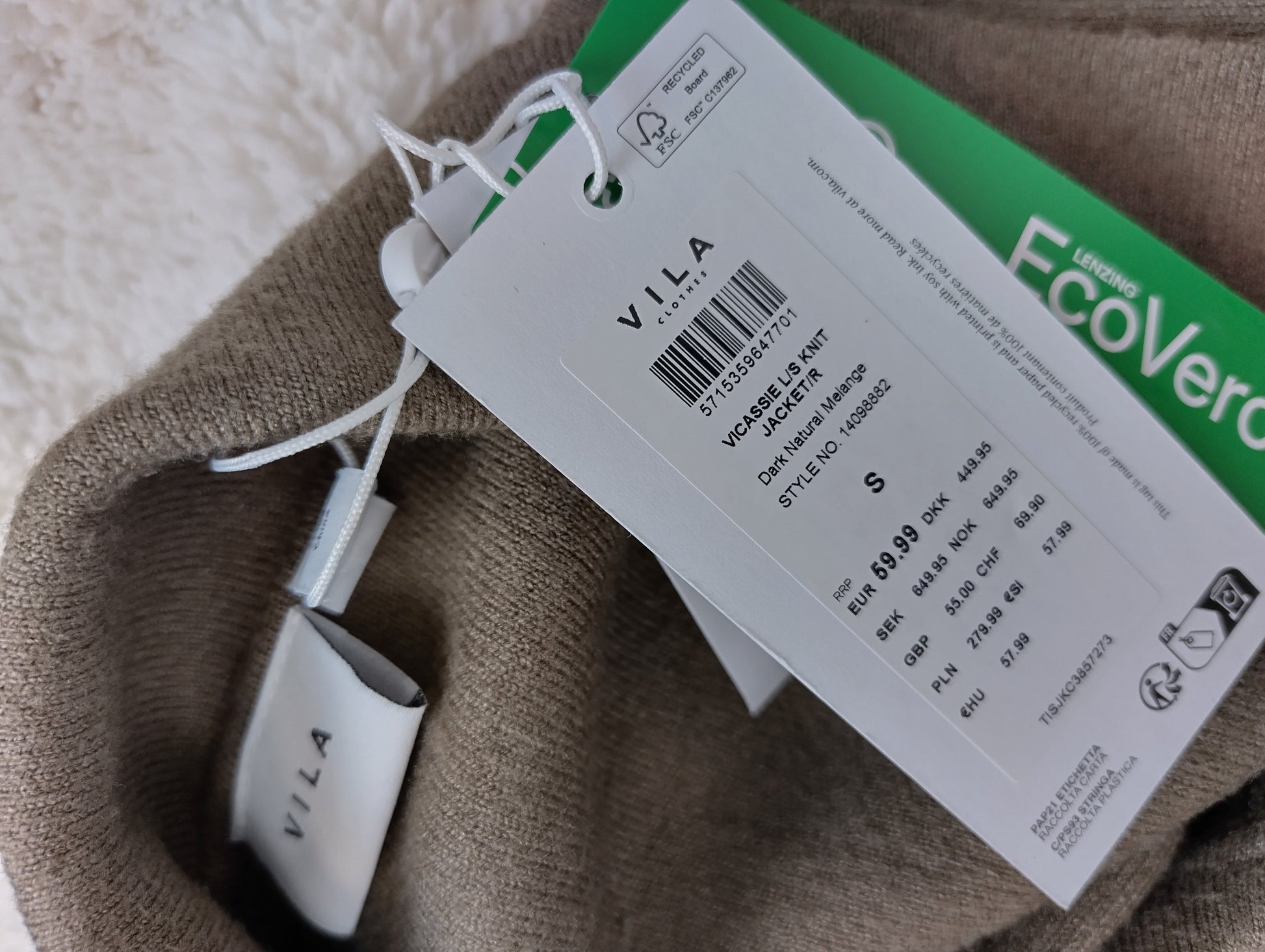 Close-up image of the Vila brand tags and size details
