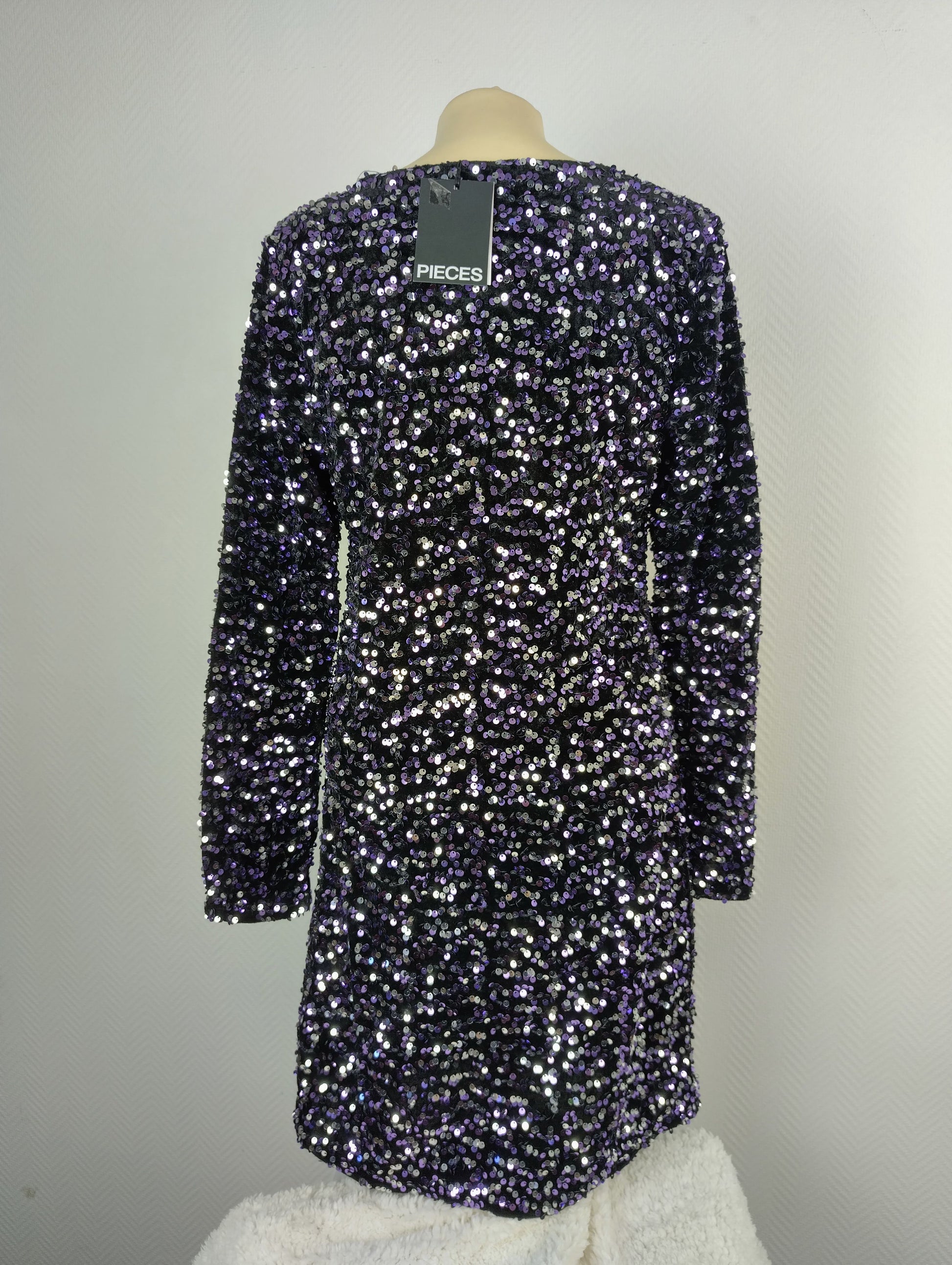Back view of black and purple sequin dress