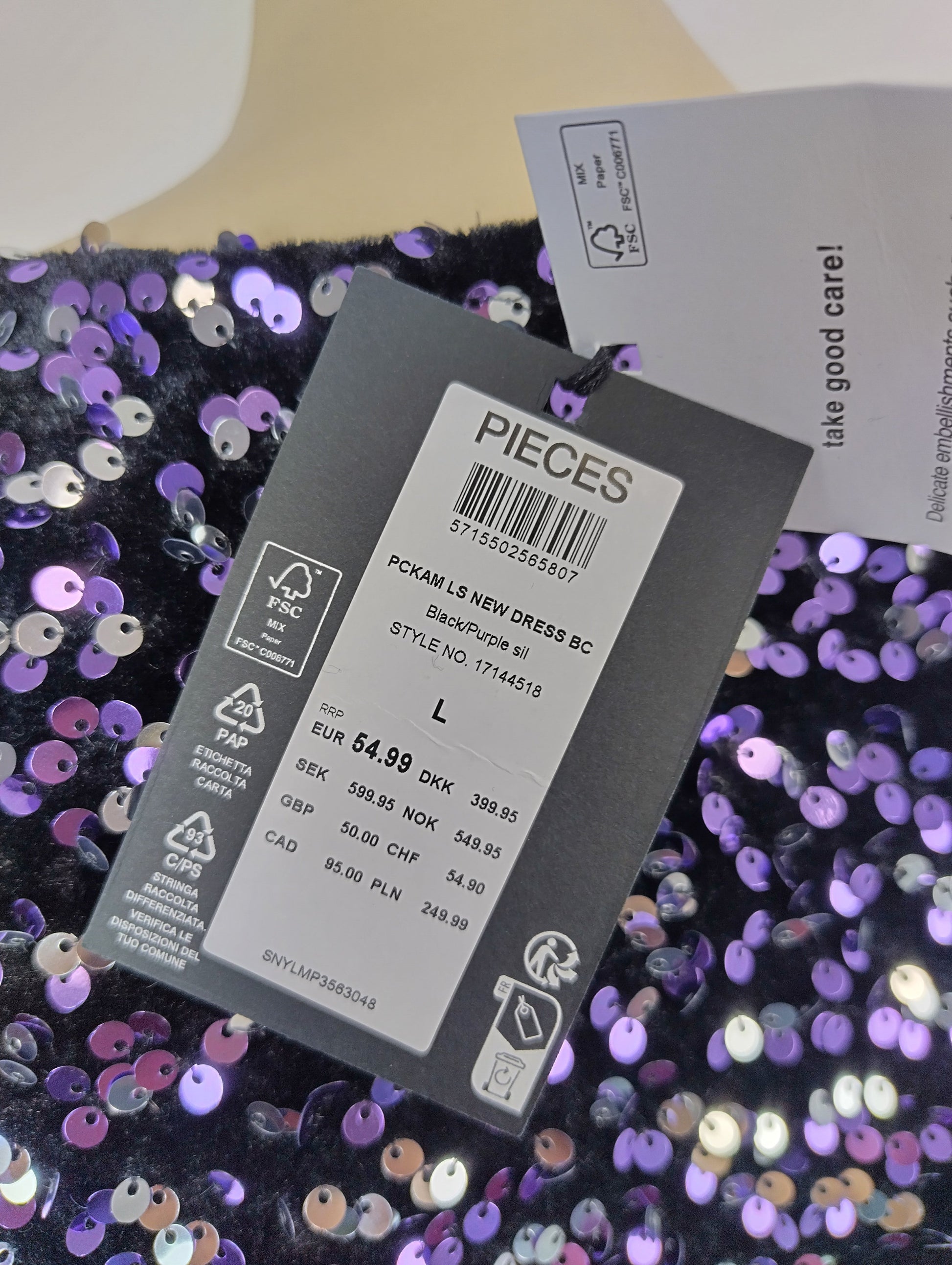 Close-up of tag on sequin dress