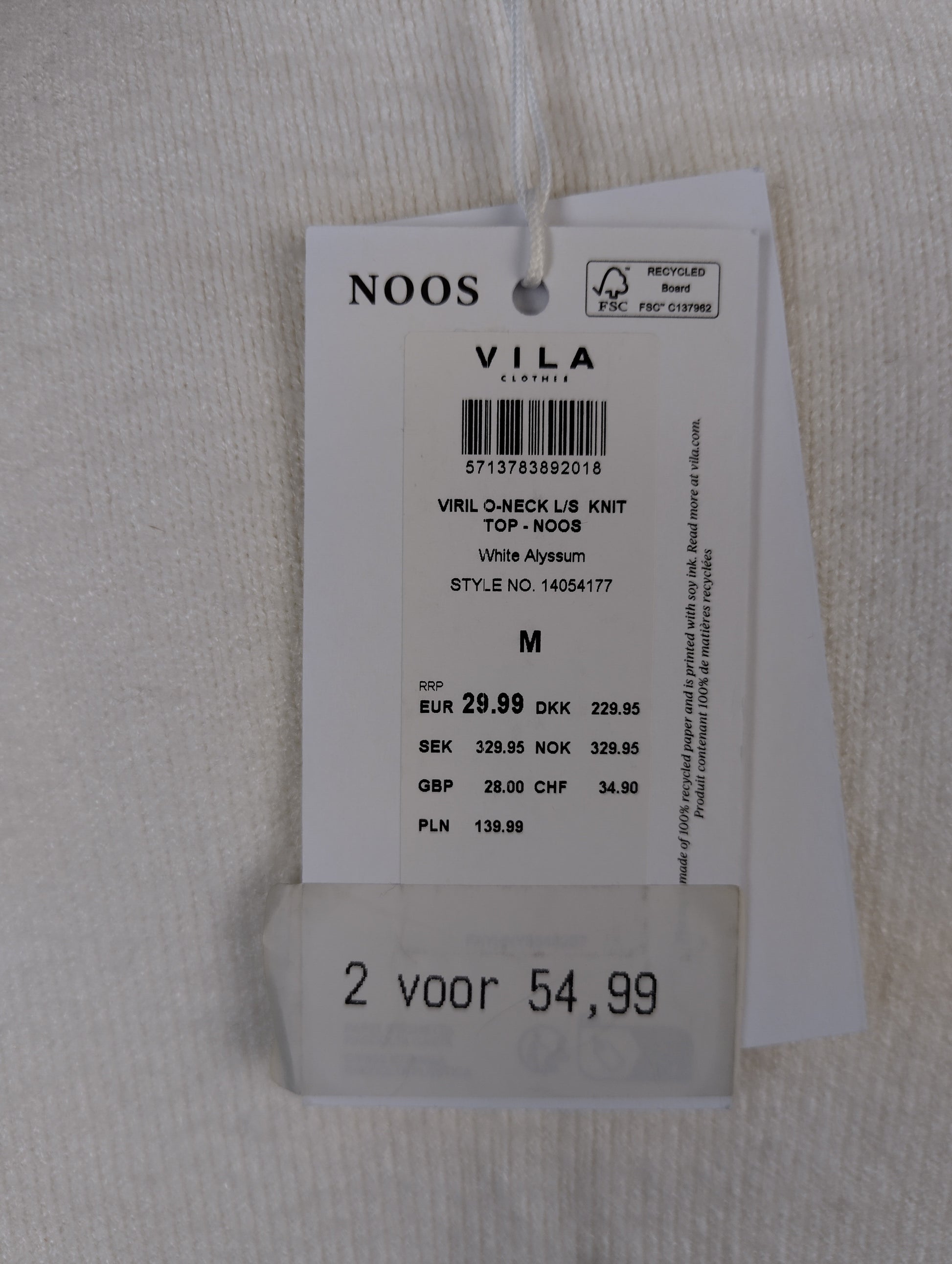 Close-up of tag showing details and pricing