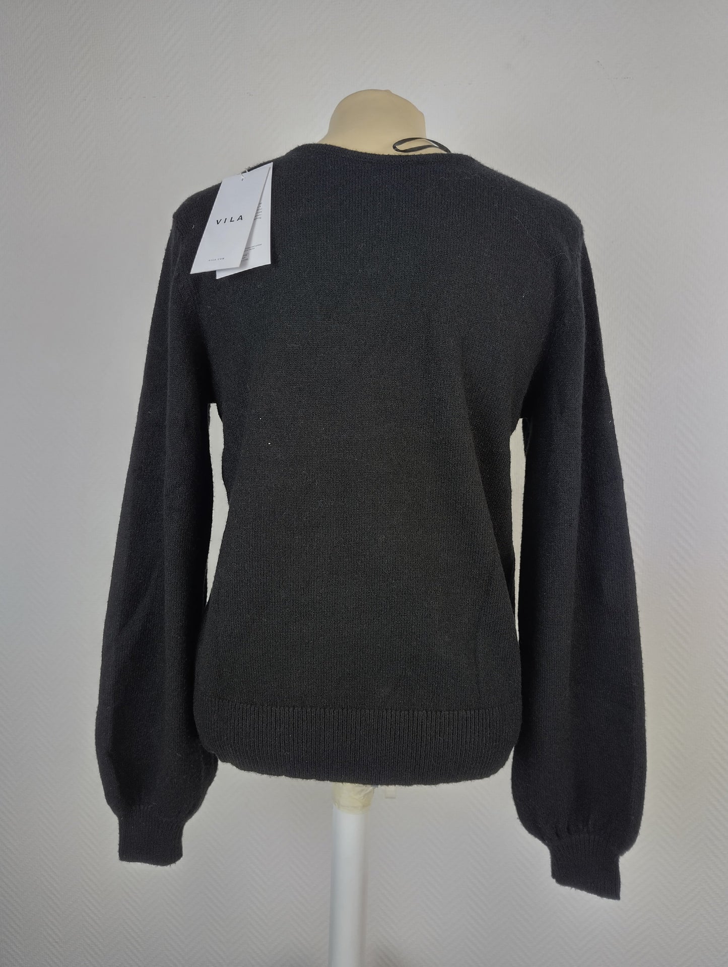Back view of black V-neck sweater