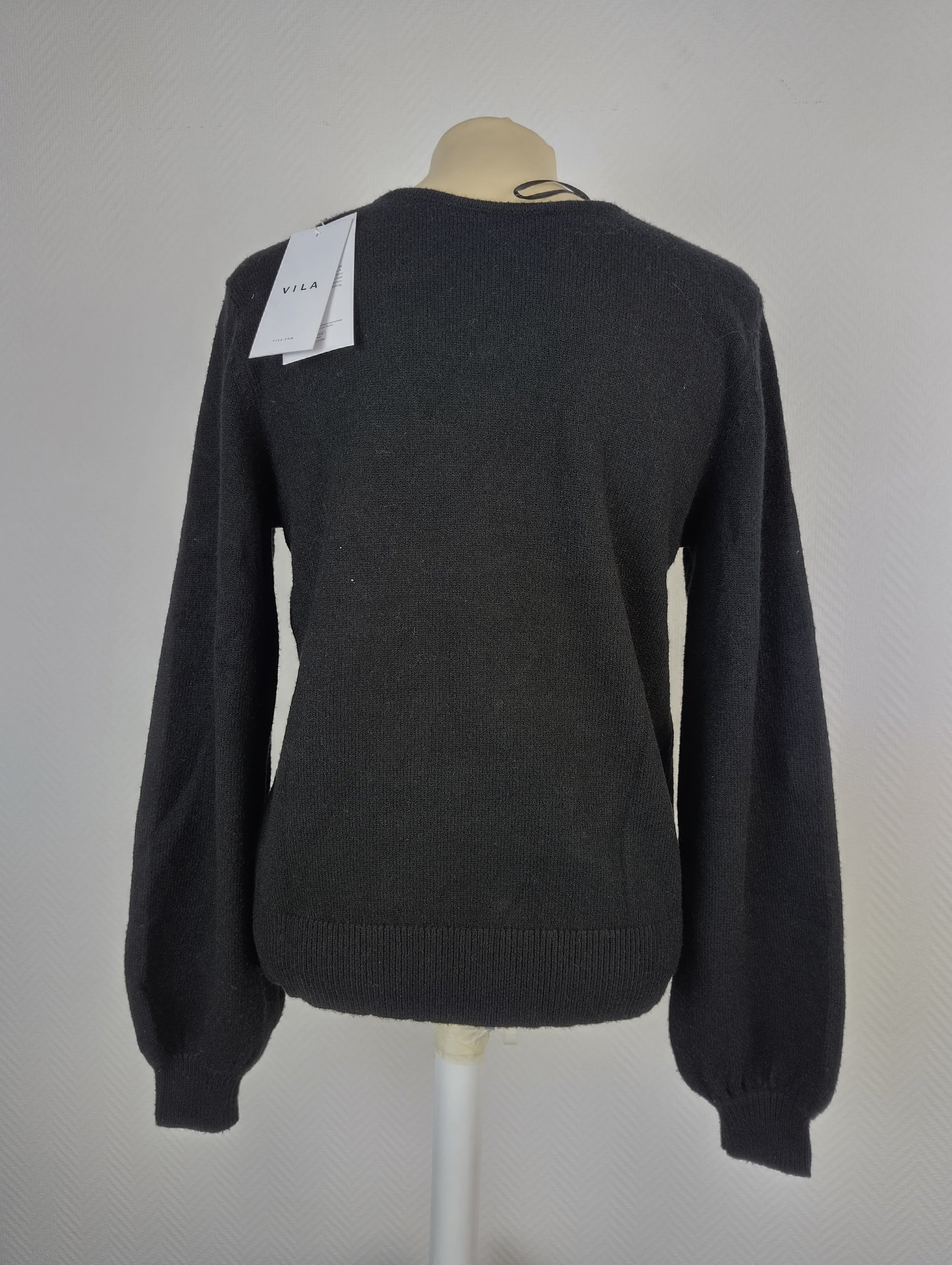 Back view of black V-neck sweater