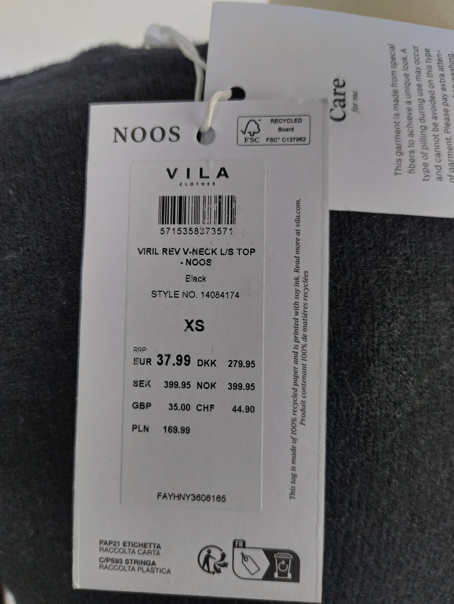 Close-up of VILA tag on sweater