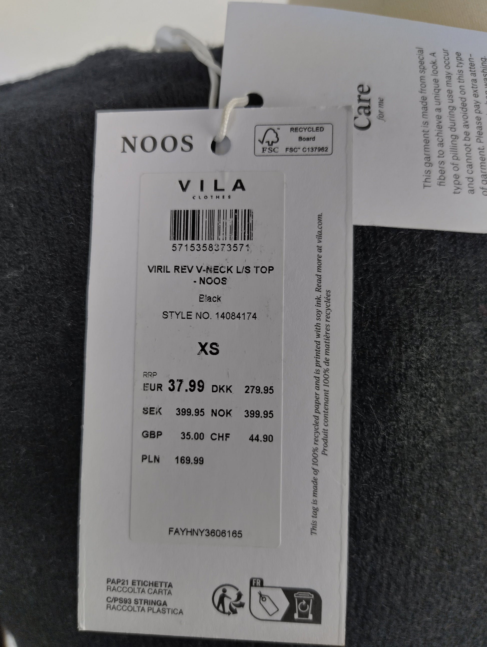 Close-up of VILA tag on sweater