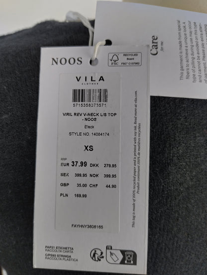 Close-up of VILA tag on sweater