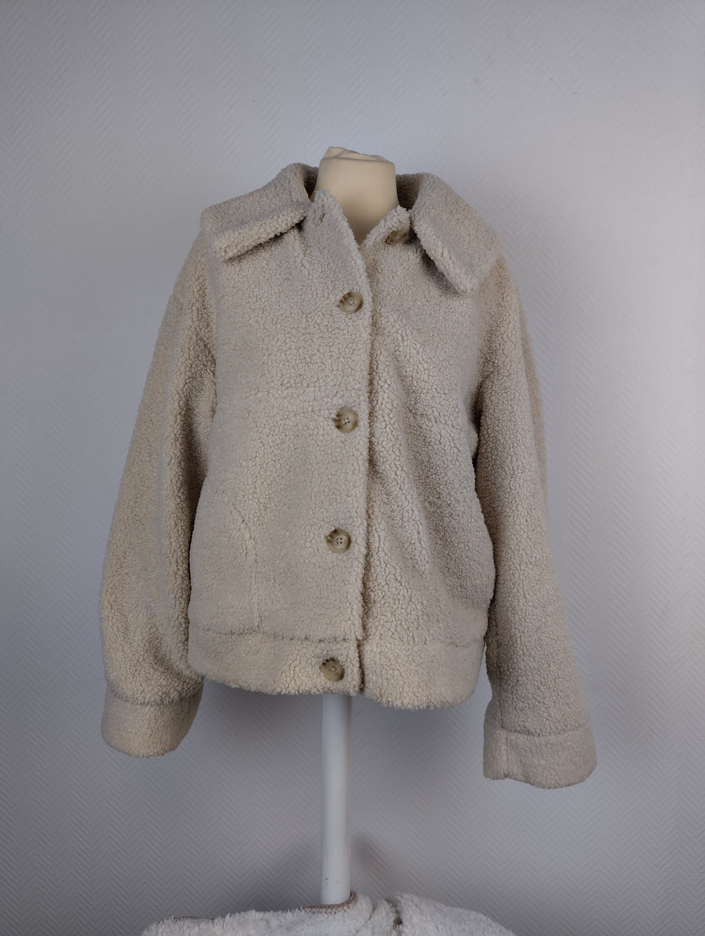 Front view of beige sherpa jacket
