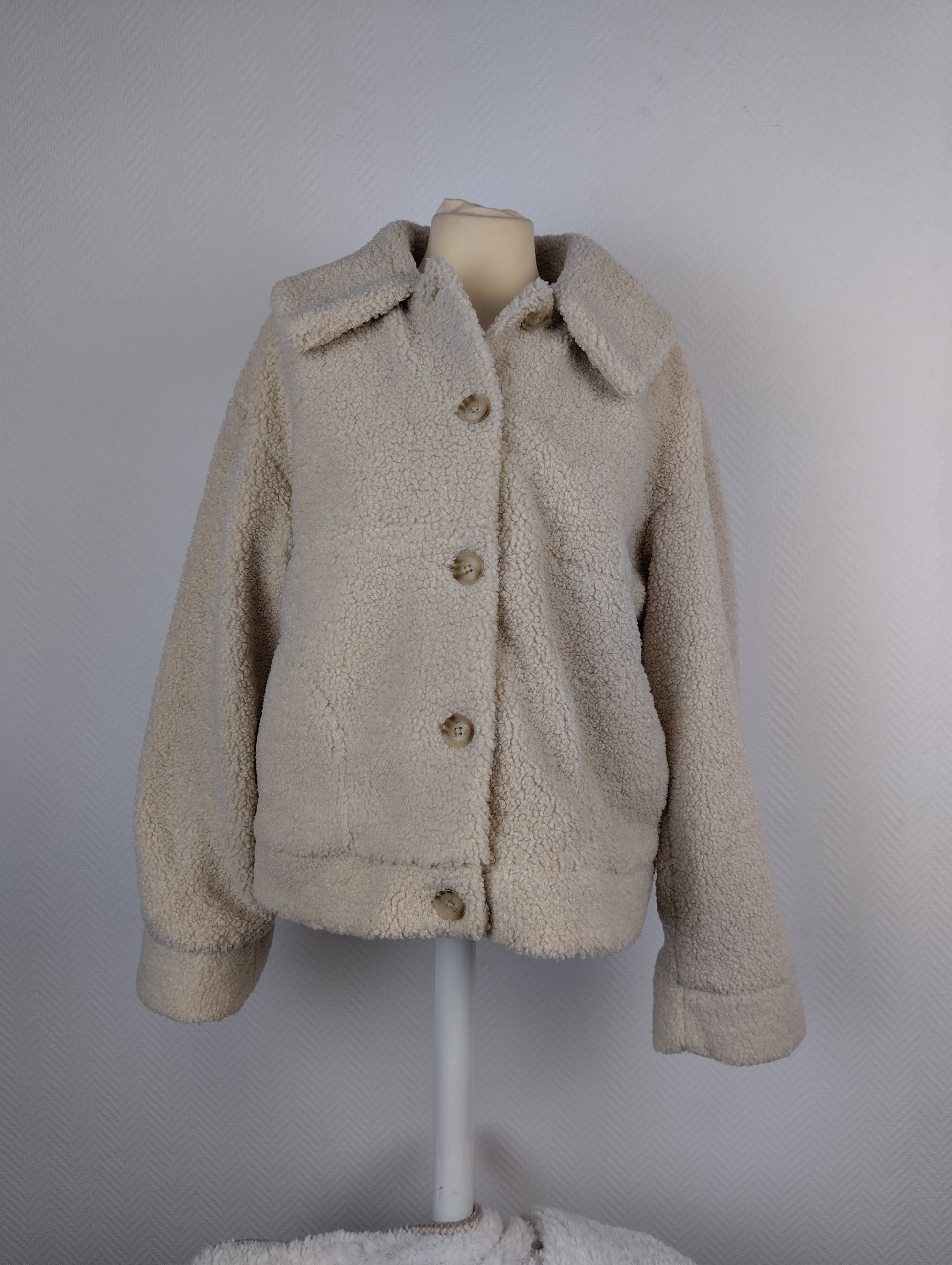 Front view of beige sherpa jacket