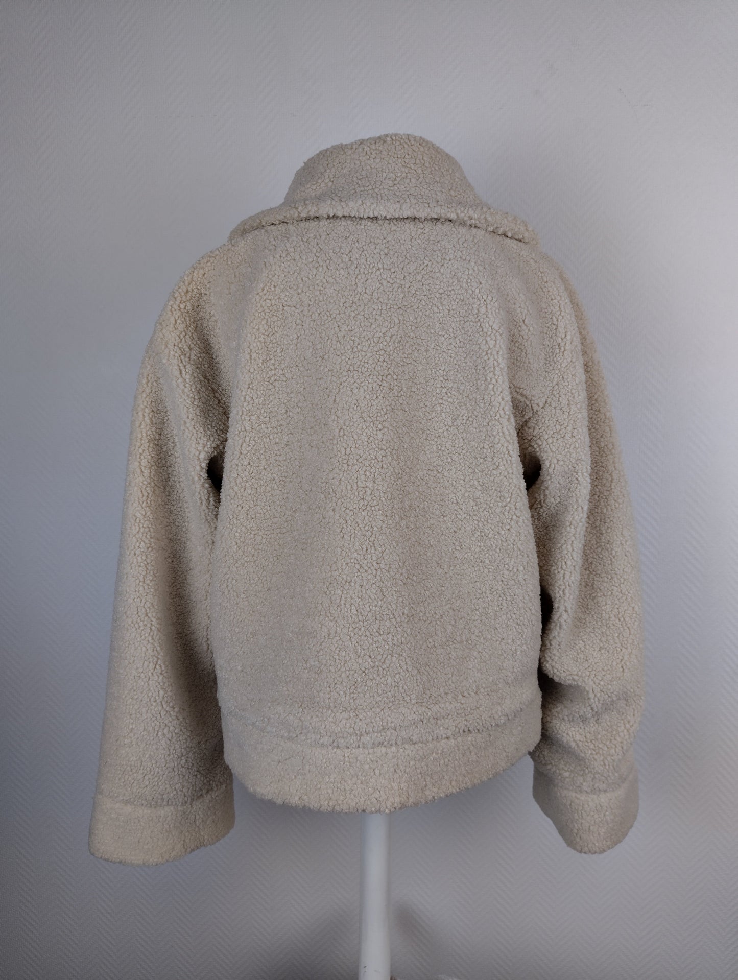 Back view of beige sherpa jacket