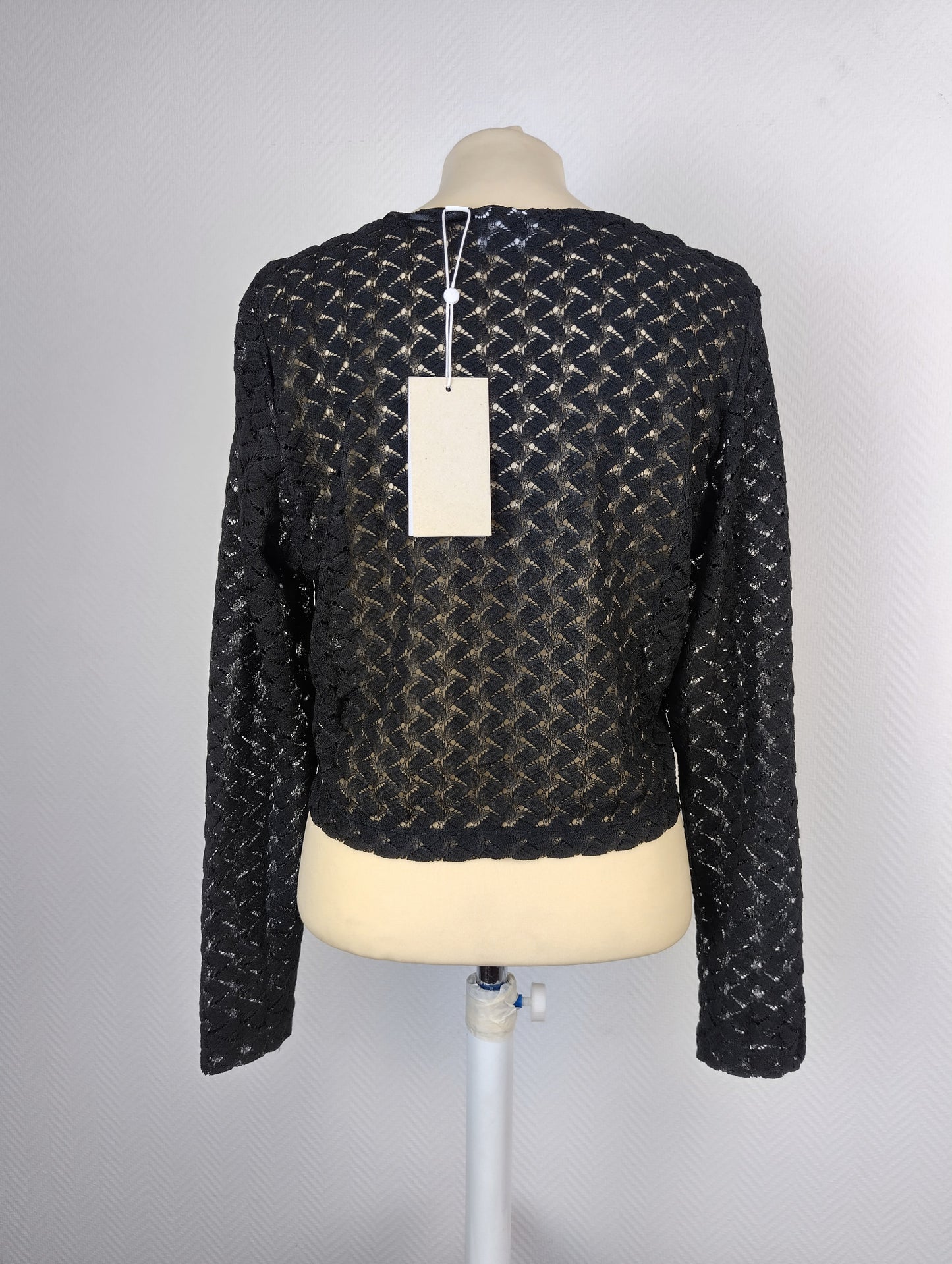 Back view of the black lace open-front cardigan