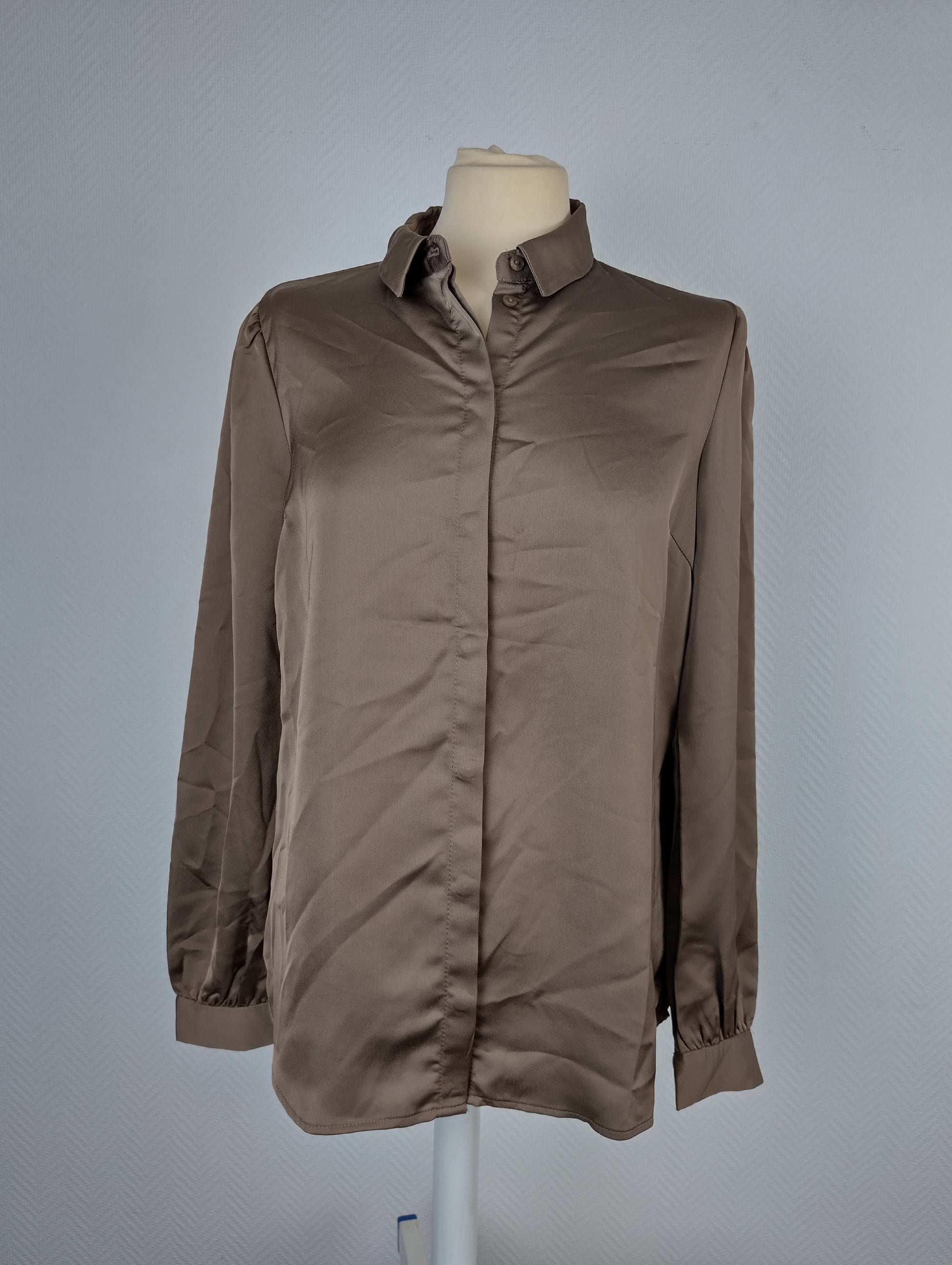 Front view of taupe blouse