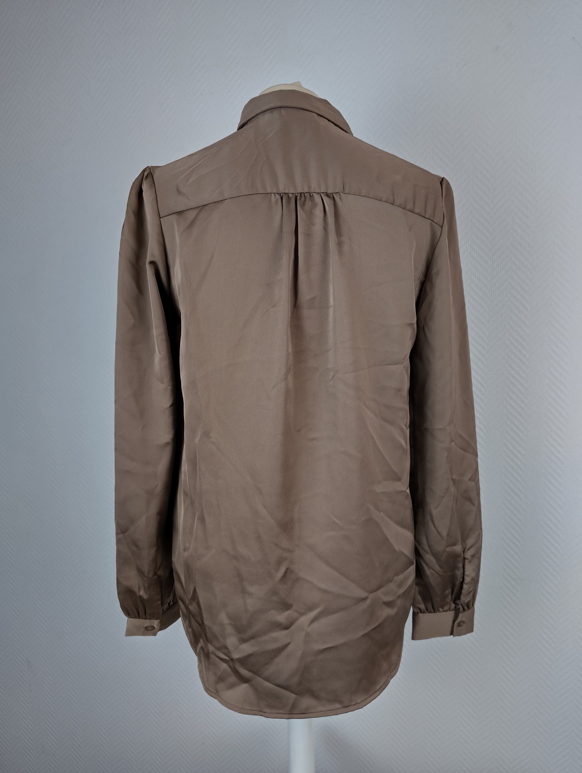 Back view of taupe blouse