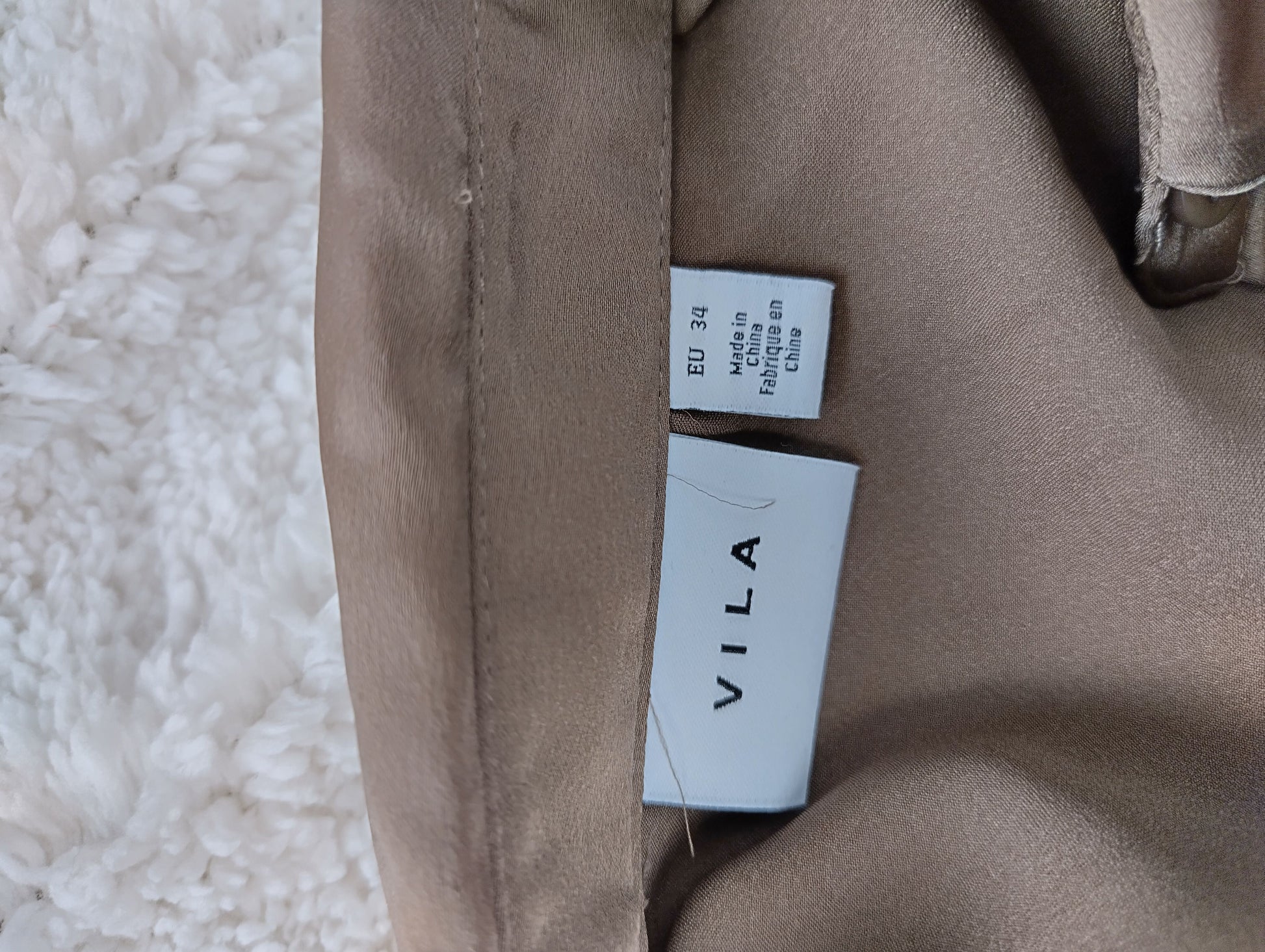 Close-up of Vila label and size tag
