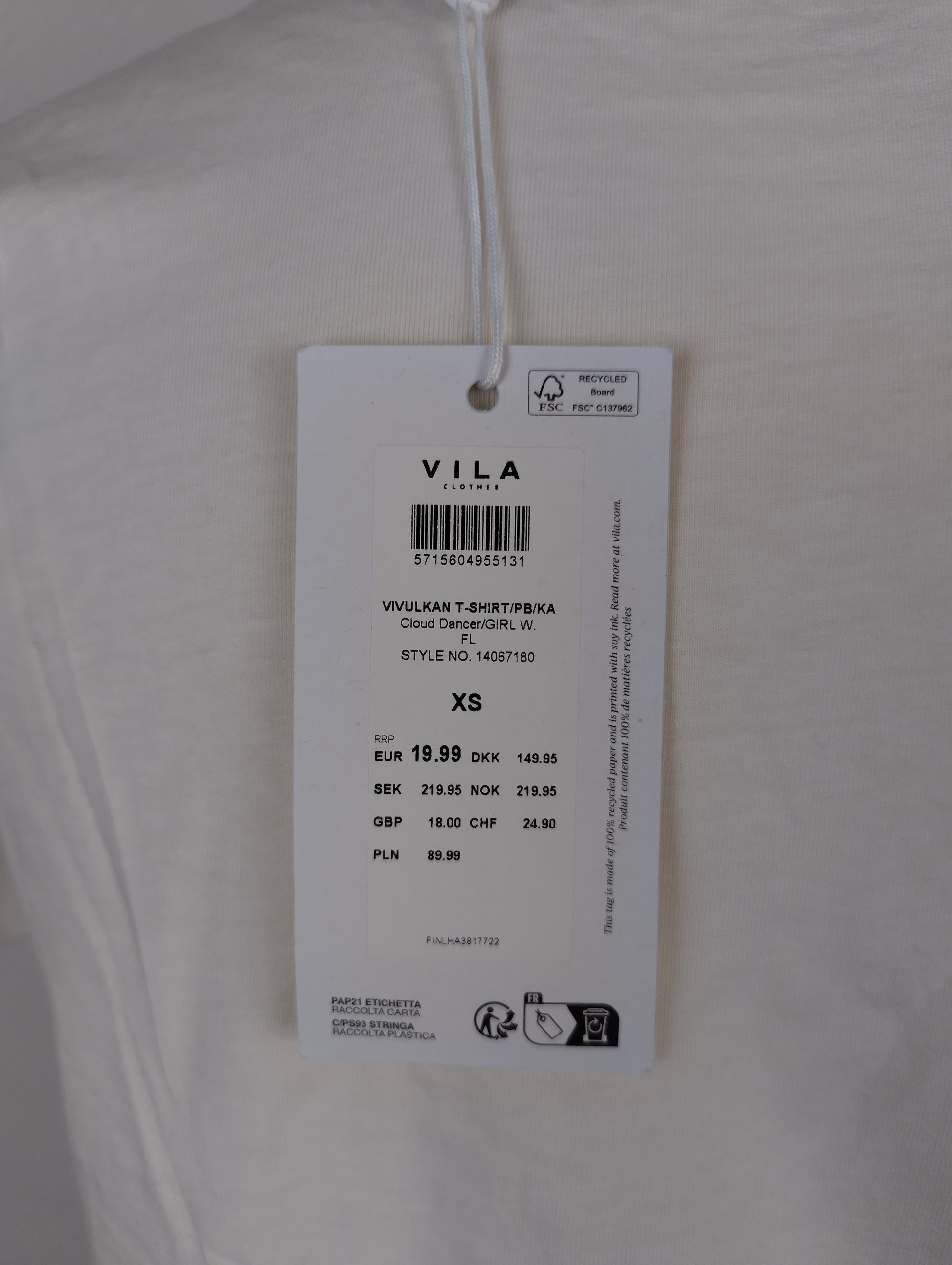 Close-up of Vila clothing tag showing size and price
