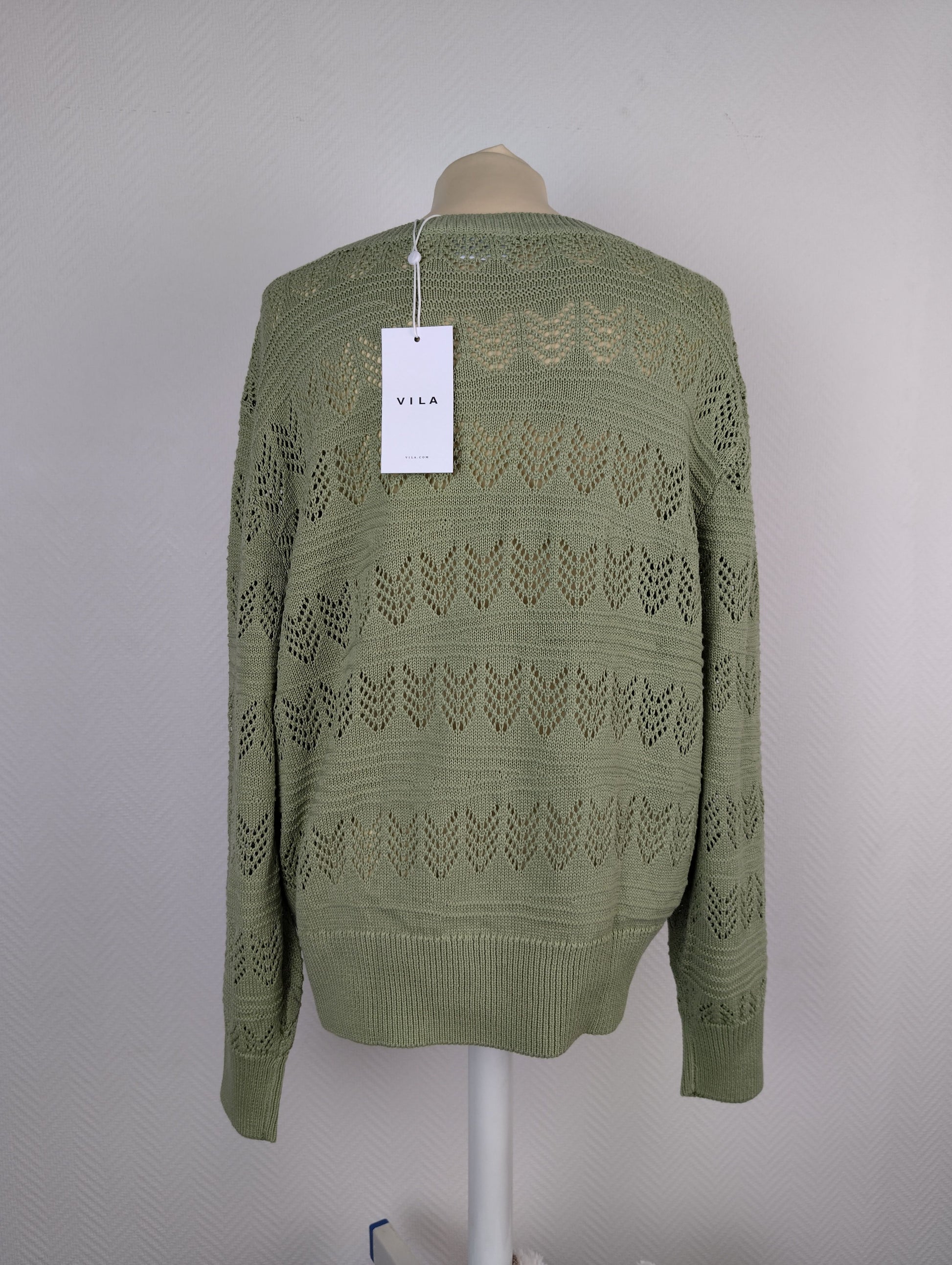 Back view with Vila tag of swamp green sweater