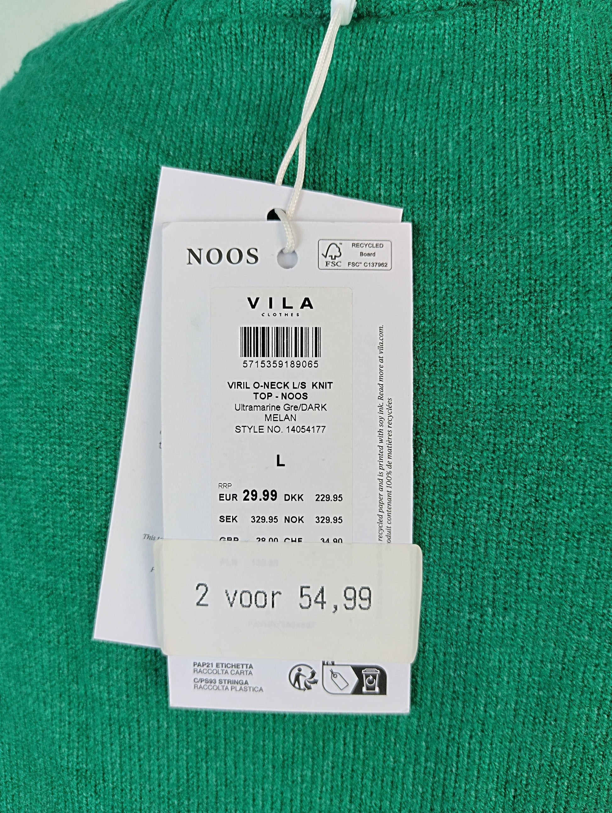 Close-up of sweater tag showing details