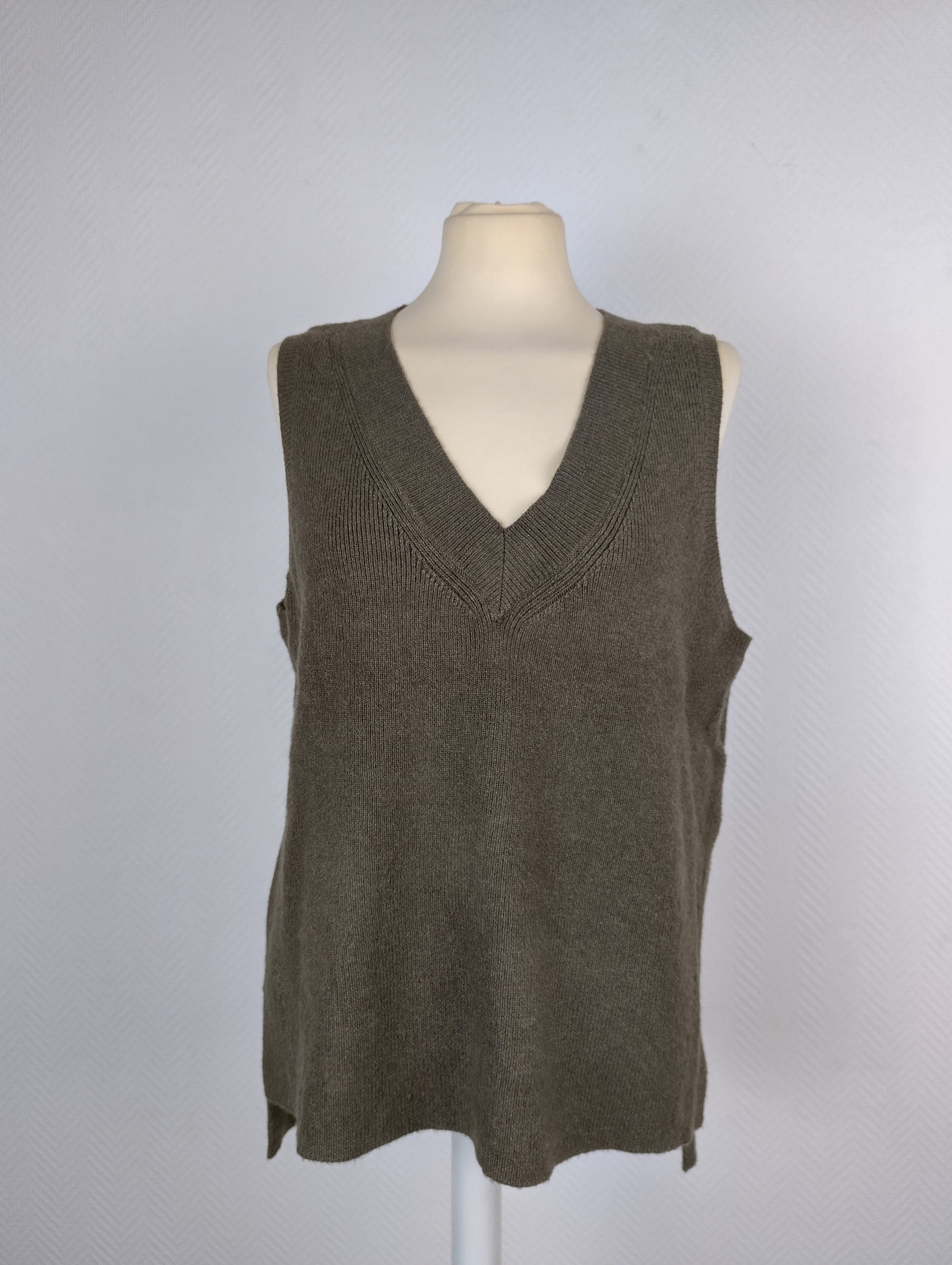 Front view of olive green knit vest