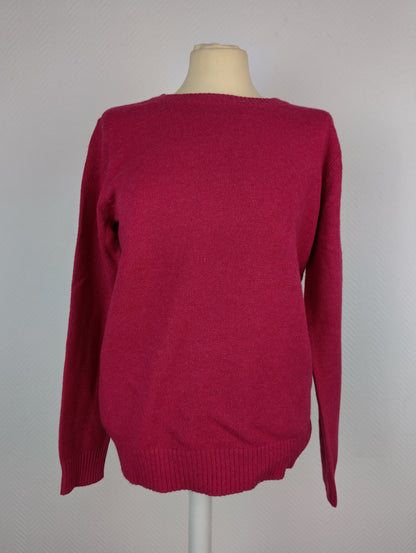 Front view of dark melon pink knit sweater on a mannequin