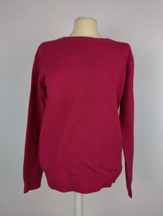 Front view of dark melon pink knit sweater on a mannequin