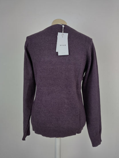 Back view of plum purple knit sweater with tag