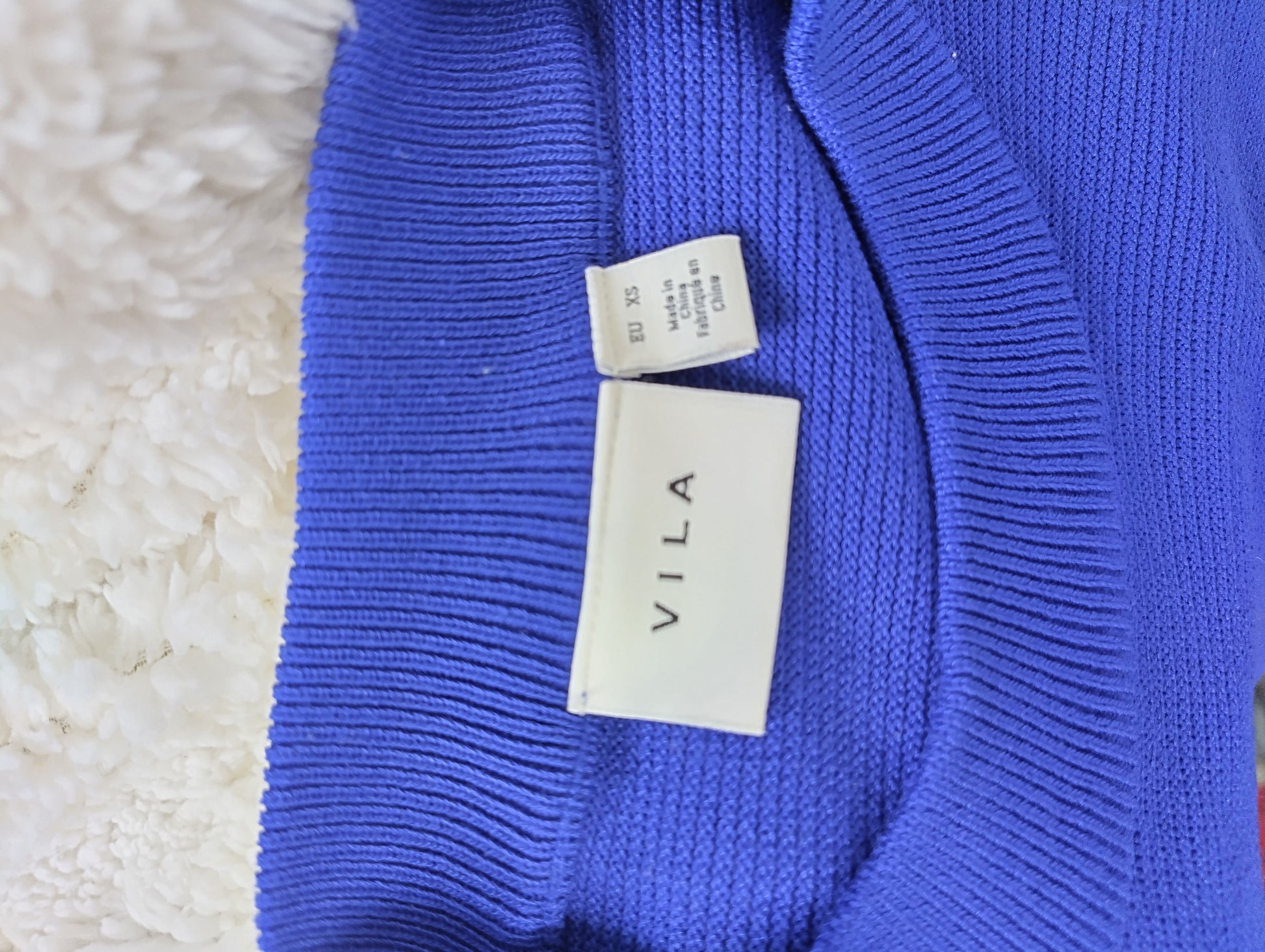 Close-up of size tag indicating XS