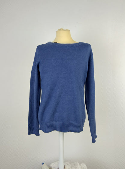 Front view of blue knit sweater on mannequin