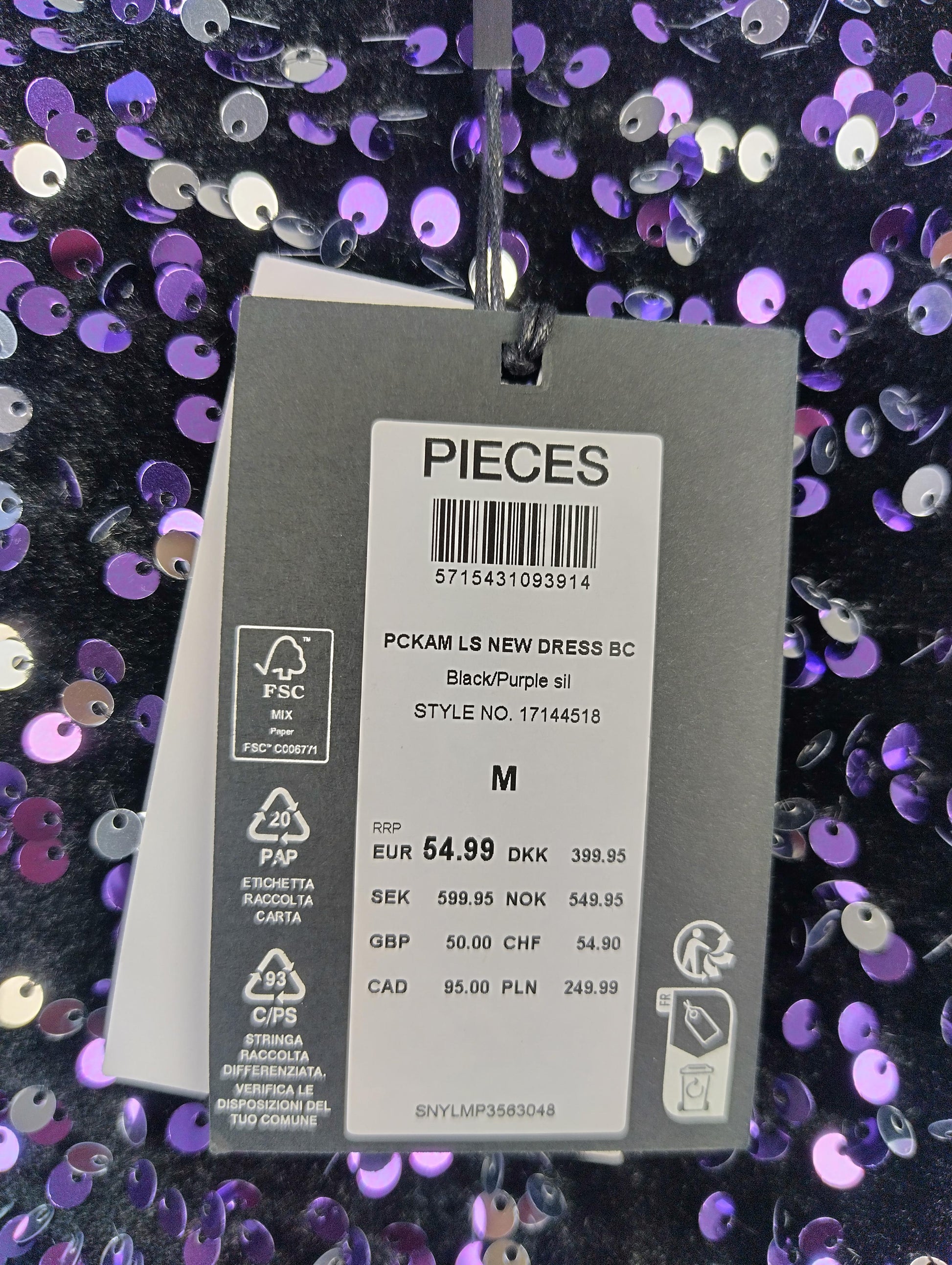 Close-up of tag showing size and price of the dress