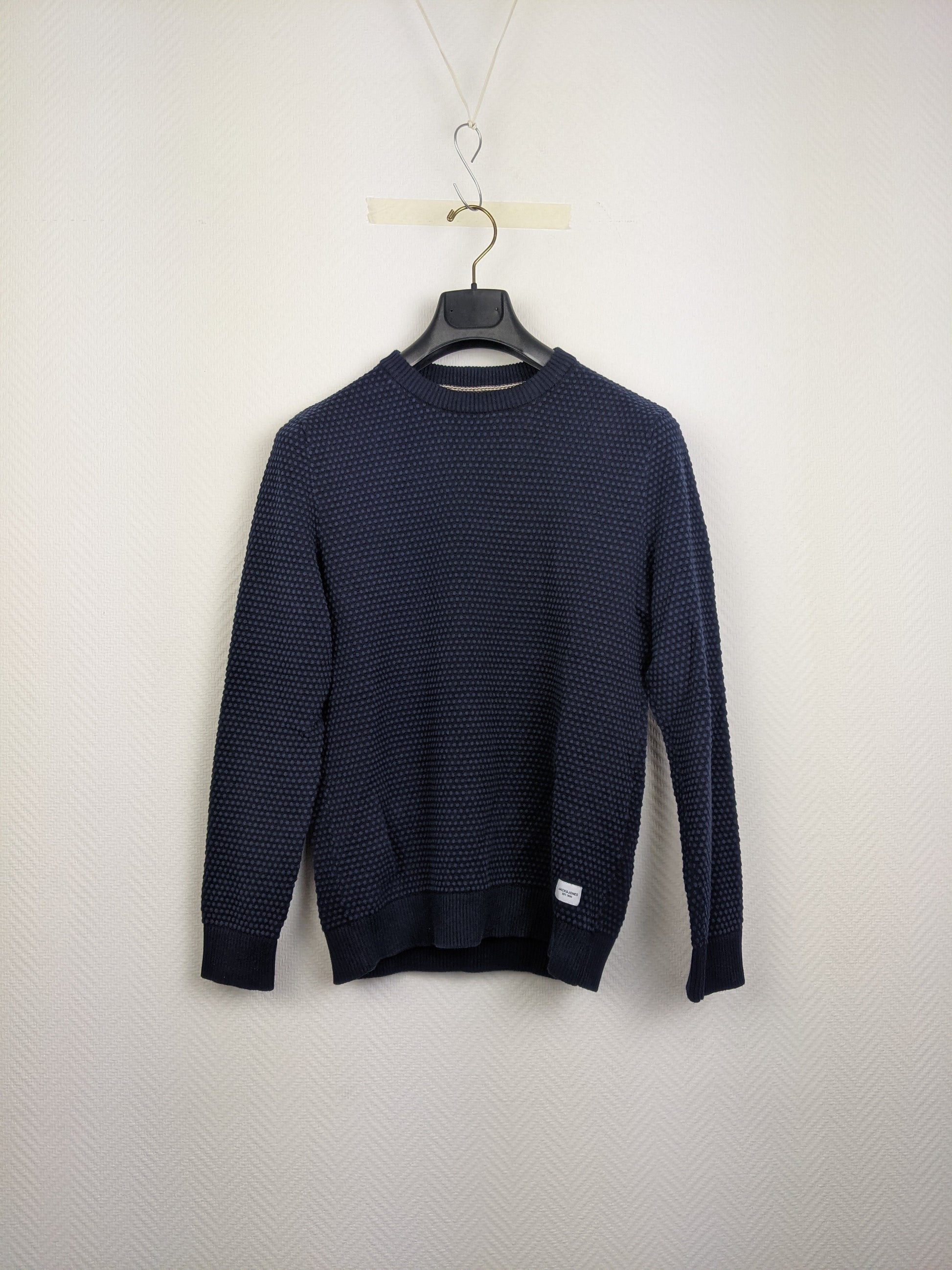 Front view of navy blue textured sweater