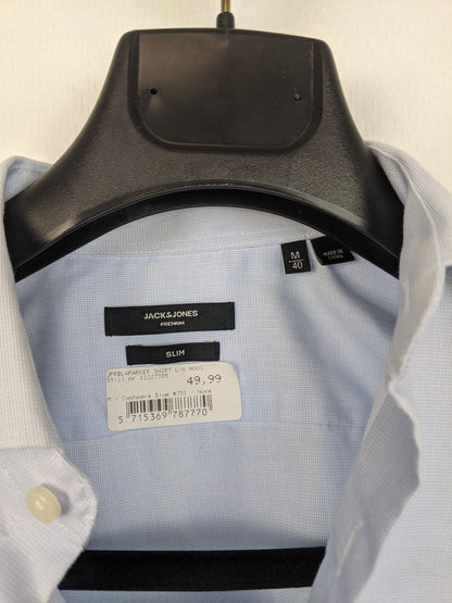 Close-up of Jack & Jones shirt label showing size and brand
