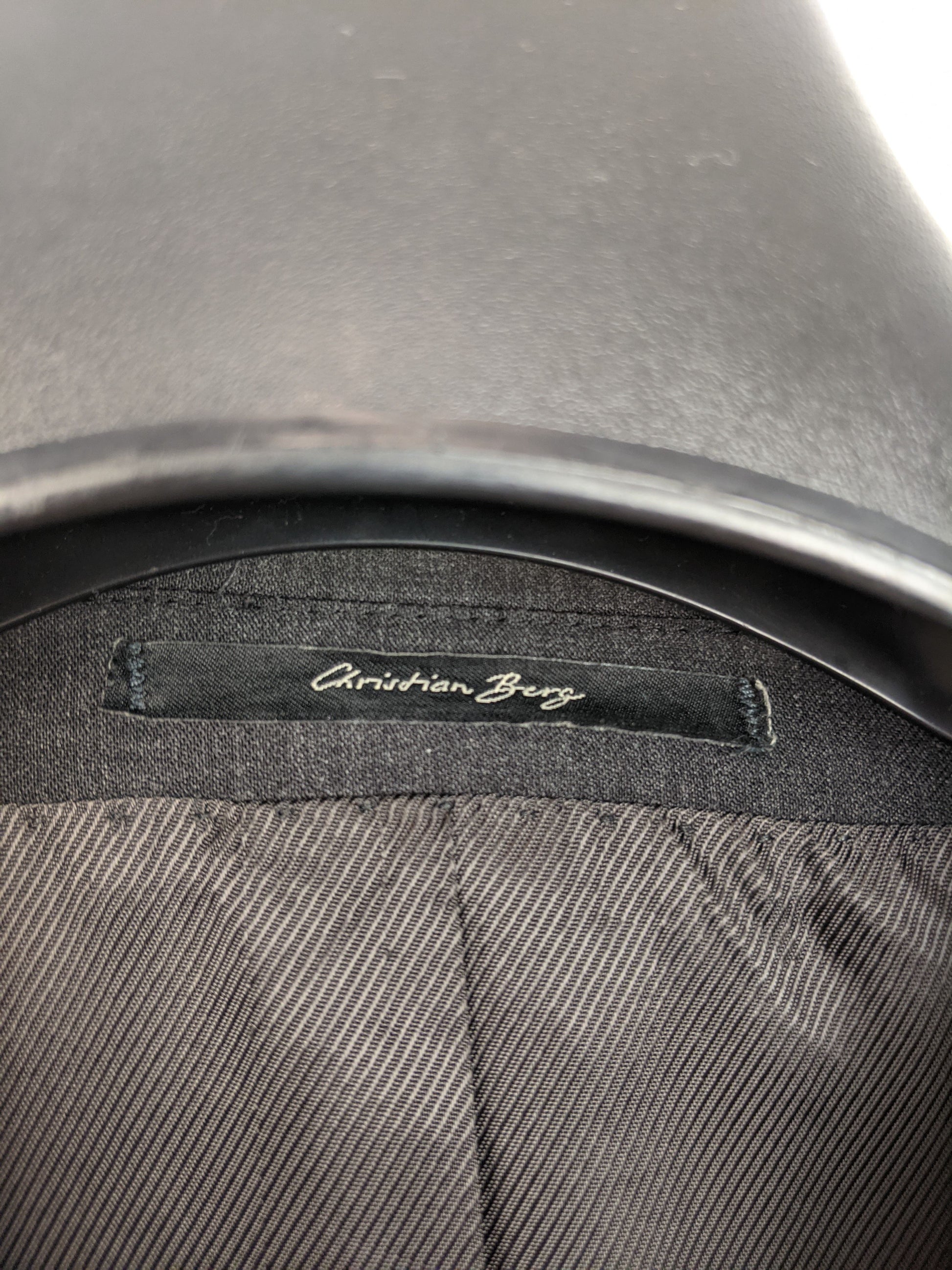 Close-up of the Christian Berg label inside the blazer