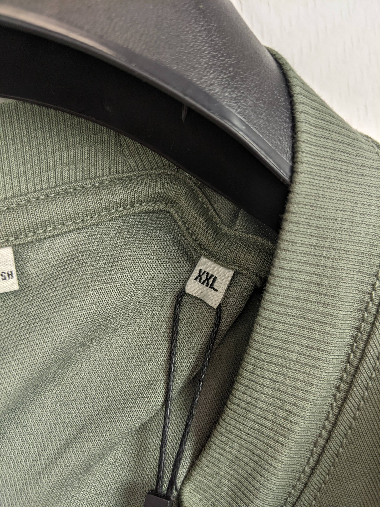 Size tag showing XXL on the T-shirt