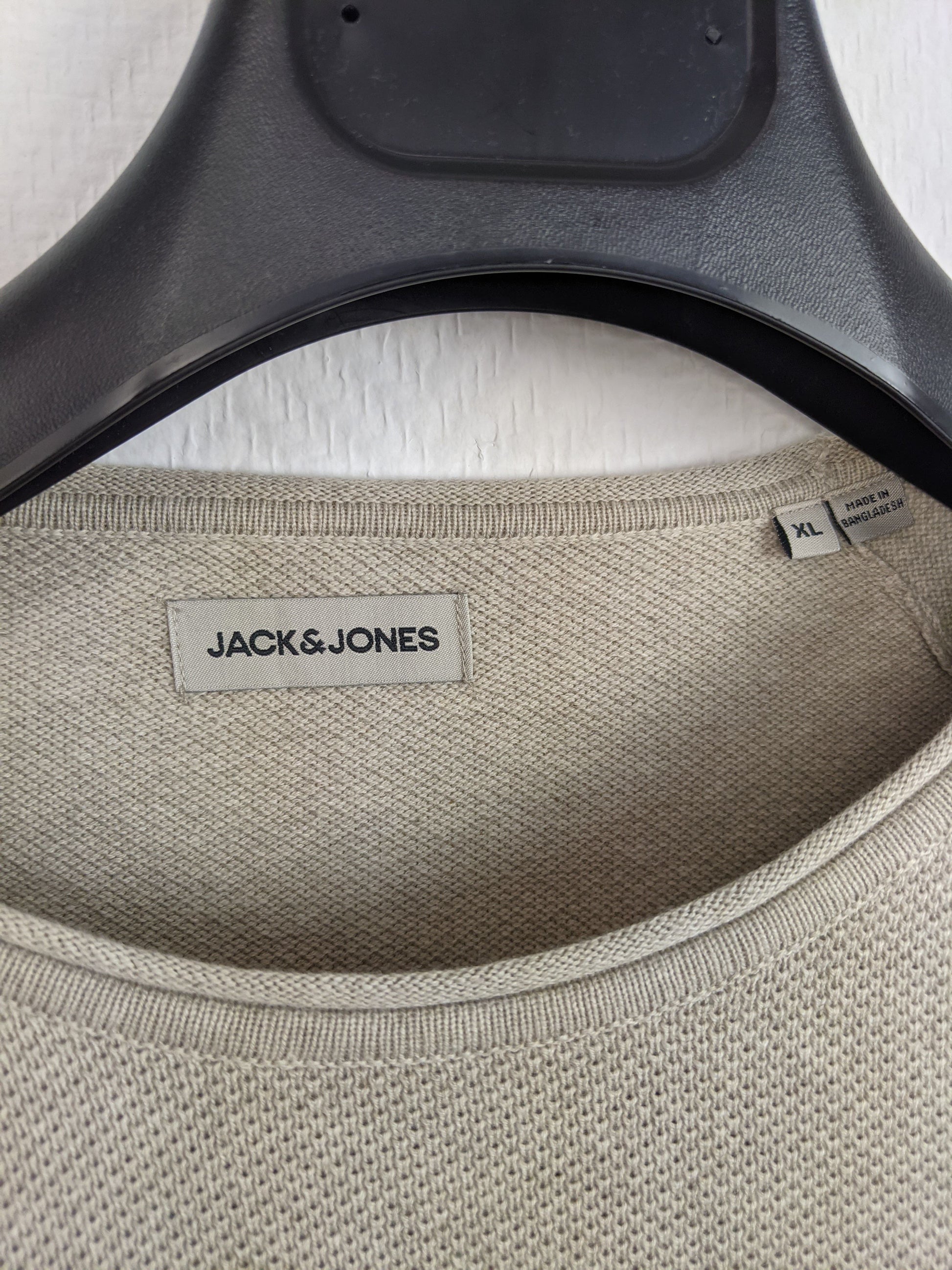 Close-up of Jack & Jones label and size tag