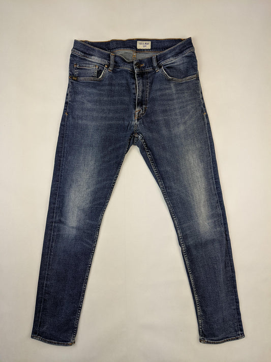 Front view of Tiger of Sweden blue denim jeans