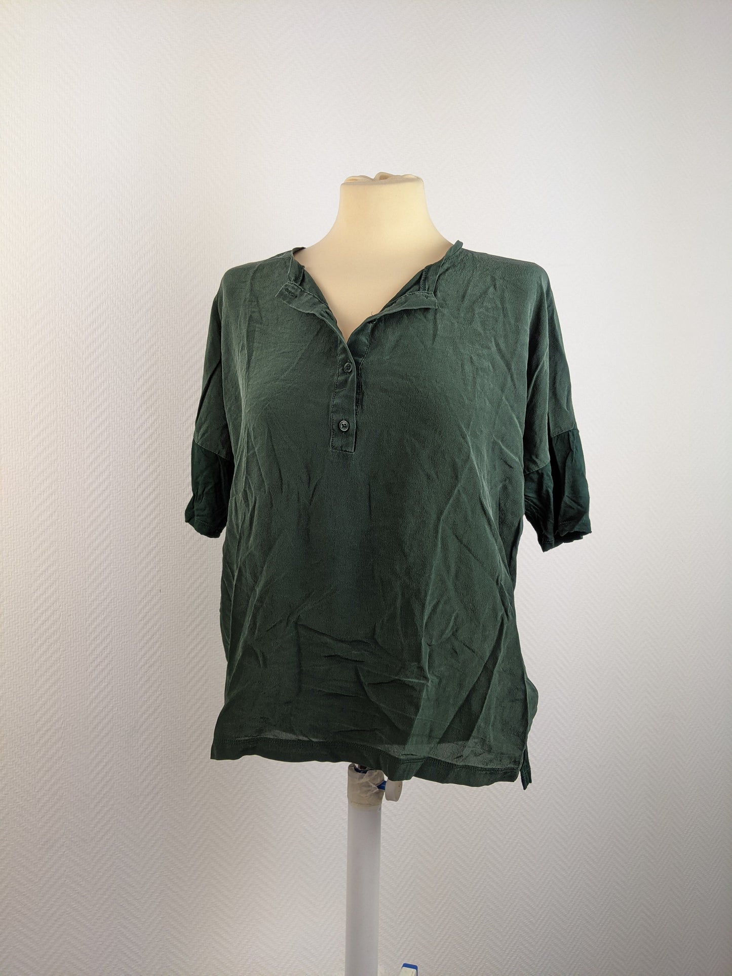 Front view of dark green blouse